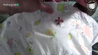 Girl pees in open messy diaper