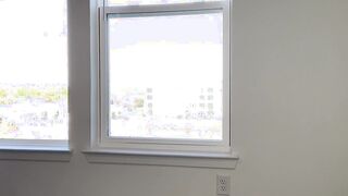 Girl messes her pull-up while looking out the window