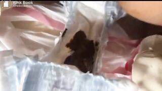 Messing Her Diaper and Cleaning Herself