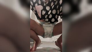 girl pees in diaper