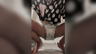 girl pees in diaper