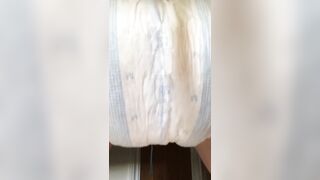 Girl pooping diaper