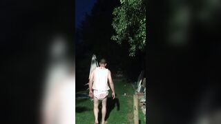 Baby being punished with hands on head in the garden