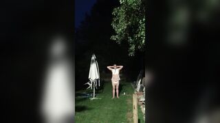 Baby being punished with hands on head in the garden