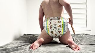 Diaper spanking for a diaper boy