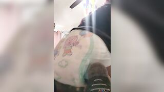 Cute girl make a push in her diaper