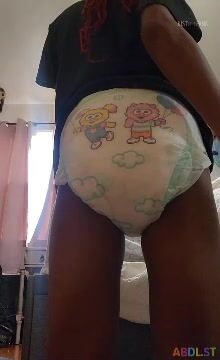 Cute girl make a push in her diaper