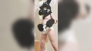 Girl rubs her diaper in fursuit