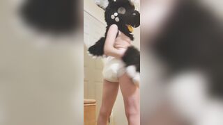Girl rubs her diaper in fursuit