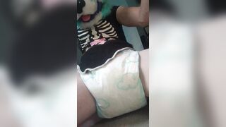 Fursuiter pees their wet diaper on ground