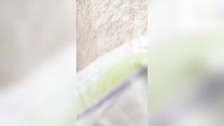 Little boy changes his own very wet diaper