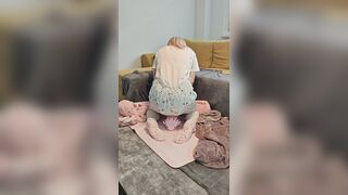 Diaper cutie bouncing on plushie