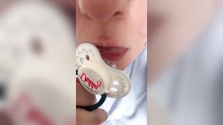 Sucking pacifier in pull-up