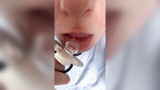 Sucking pacifier in pull-up