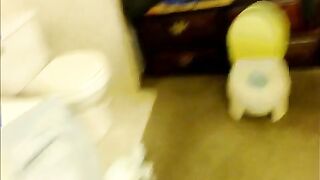 Girl pulls down diaper and potty pee