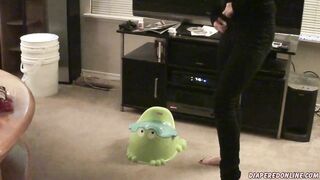 girl pee on green froggy potty