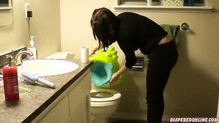 girl pee on green froggy potty