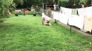 Baby sissy walks on all fours in the lawn