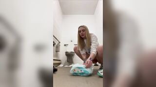 Woman chaning her poop diaper public bathroom